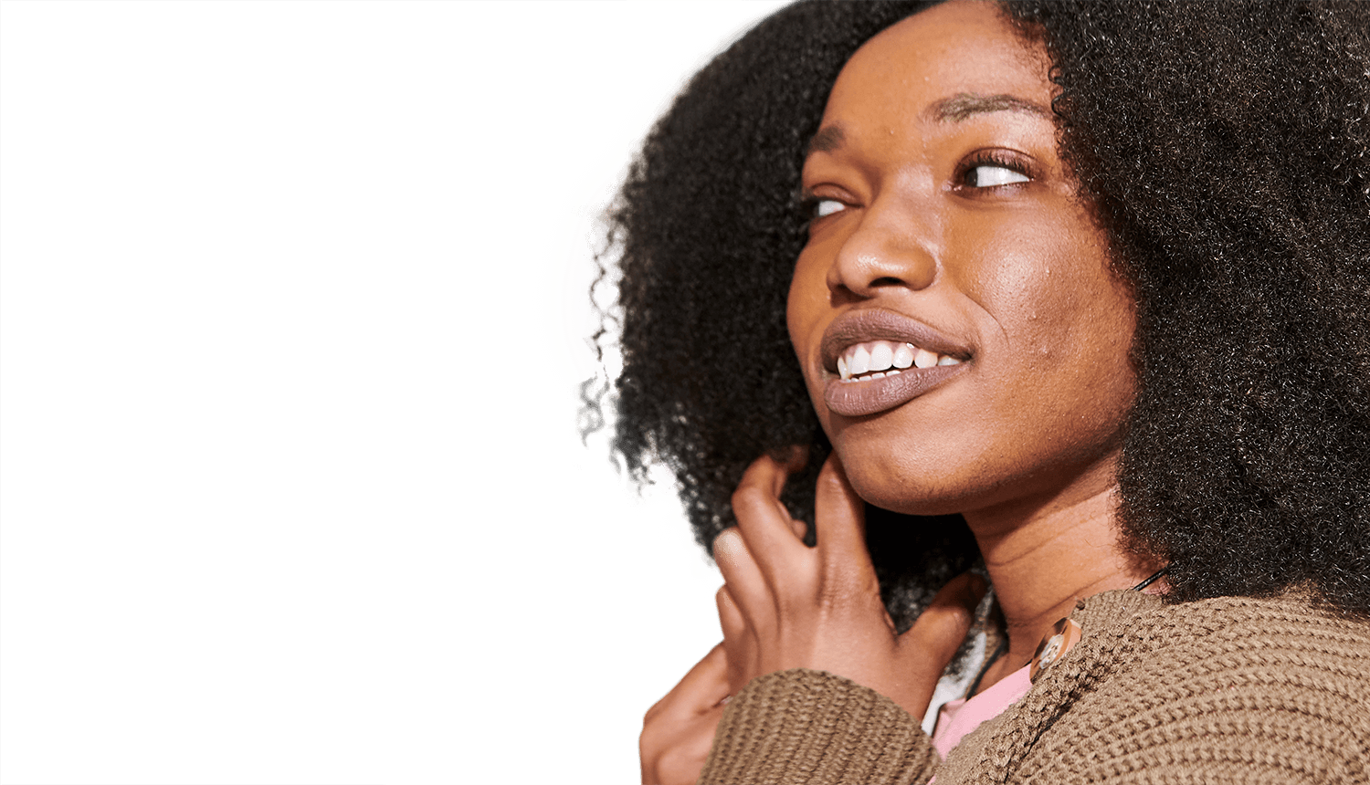 Women smiling and playing with her hair.